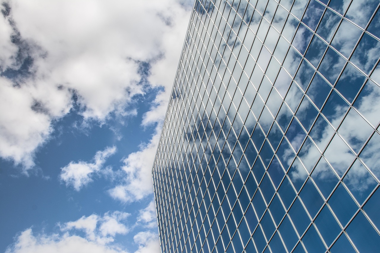Building, reflection, clouds — An Overview of Leading Online Weed Dispensaries in Canada