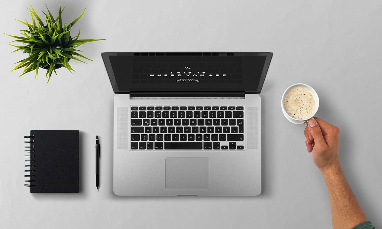 Laptop, coffee, arm — Find Convenient Nuru Massage Near Me for Ultimate Relaxation